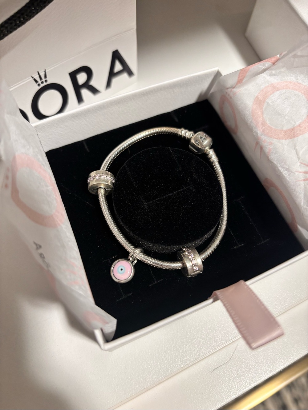 Brand new, in box: Pandora Silver Bracelet with Pink and White Evil Eye Charm